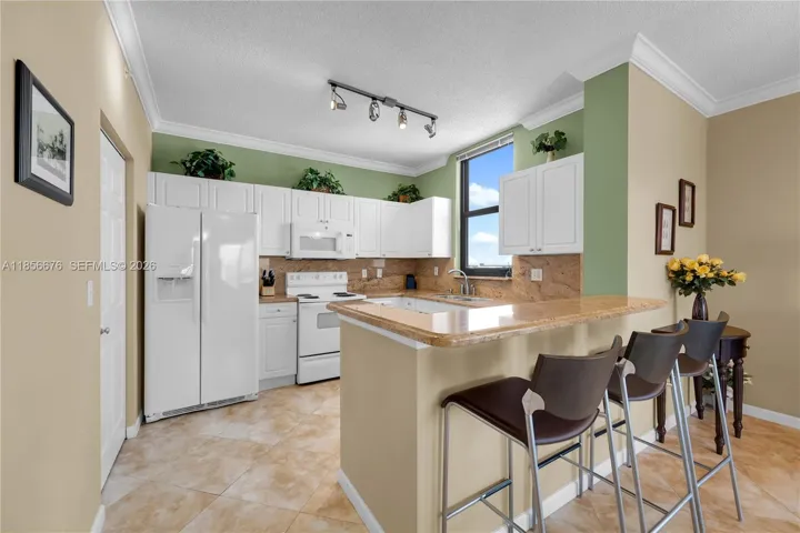 Open Kitchen and Counter-Dining Area. Perfect for hosting friends or family!651 Okeechobee Blvd., Unit #1002, West Palm Beach, FL. City Place Tower Condominium. For Sale.