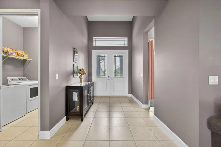 Long hallway with one bedroom off to the other side