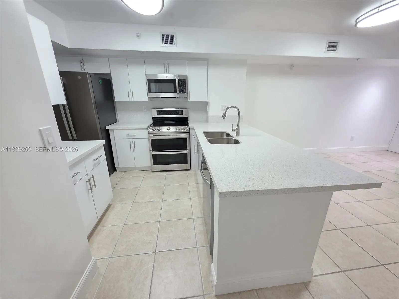 NEW QUARTZ COUNTERTOPS AND CABINETS