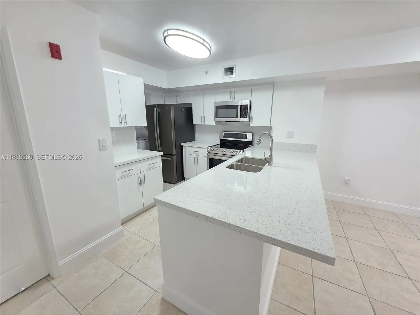 NEW QUARTZ COUNTERTOPS AND CABINETS