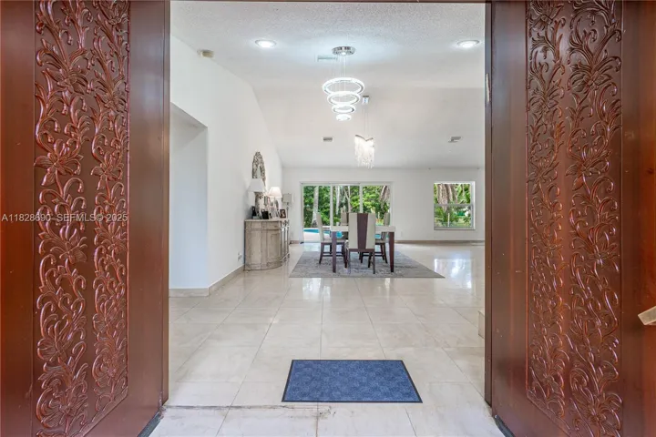 Double entry doors lead to dining