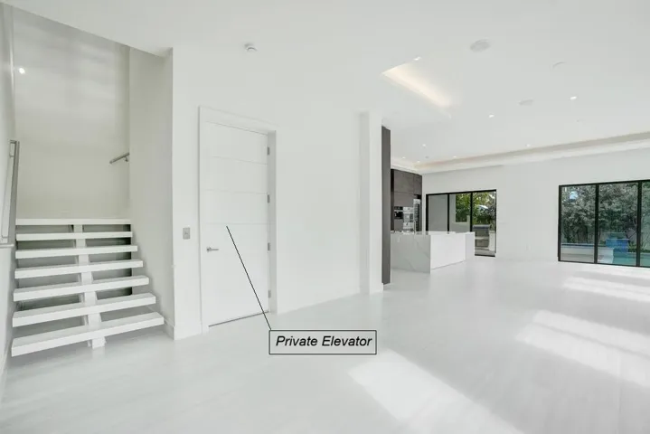 Private Elevator adjacent to Floating Stairs