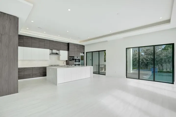 Open-Concept Kitchen Flowing into Dining and Living Areas.