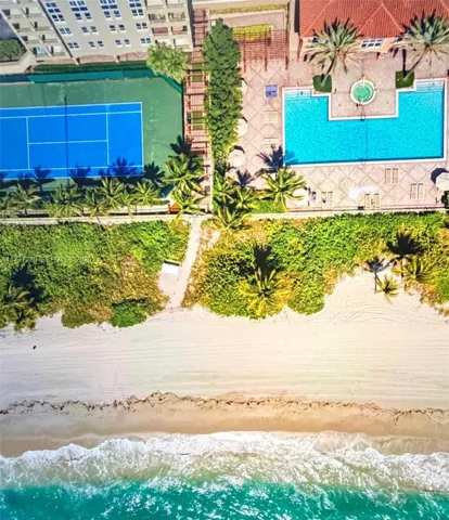 2080 AERIAL VIEW POOL AND TENNIS COURT.