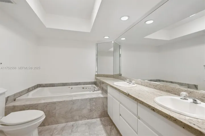 Spacious Primary Bathroom w/ Dual Sinks, Standup Shower and Separate Tub.