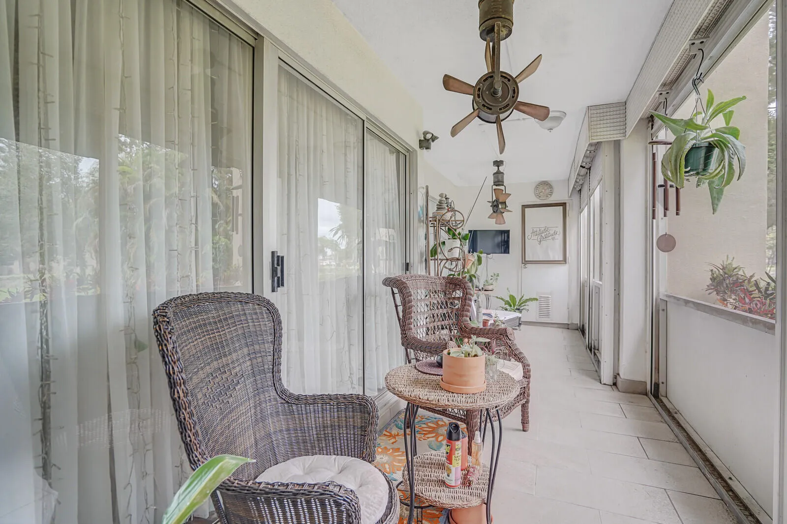 Spacious, screened patio overlooking green space and canal