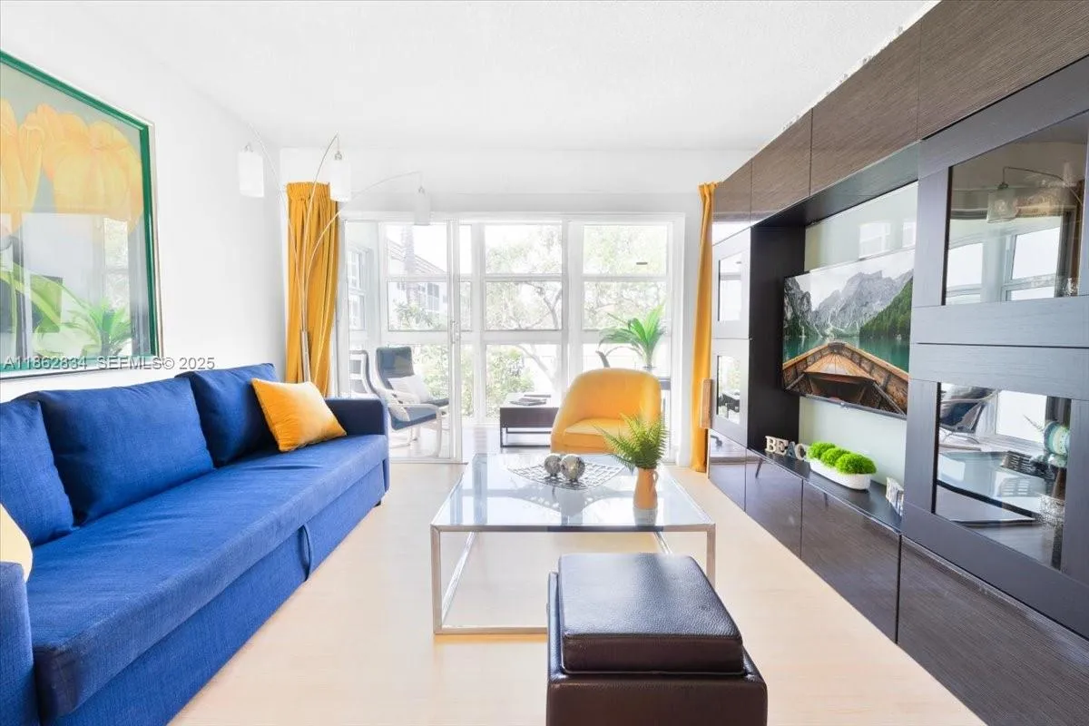 Living room has sliding doors to separate Florida room if privacy is needed