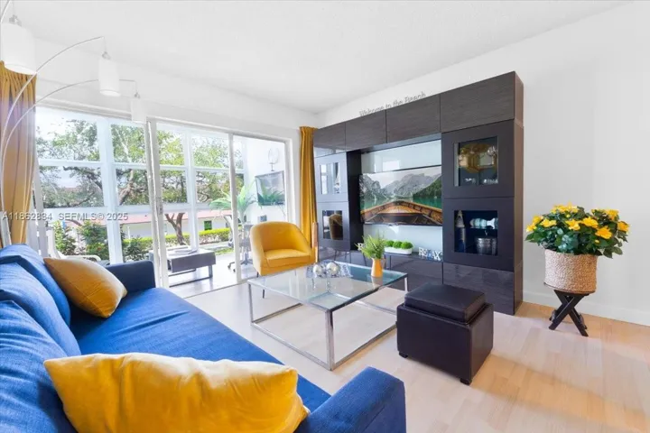 Beautiful living area connected to Florida room to sit and relax with a morning coffee