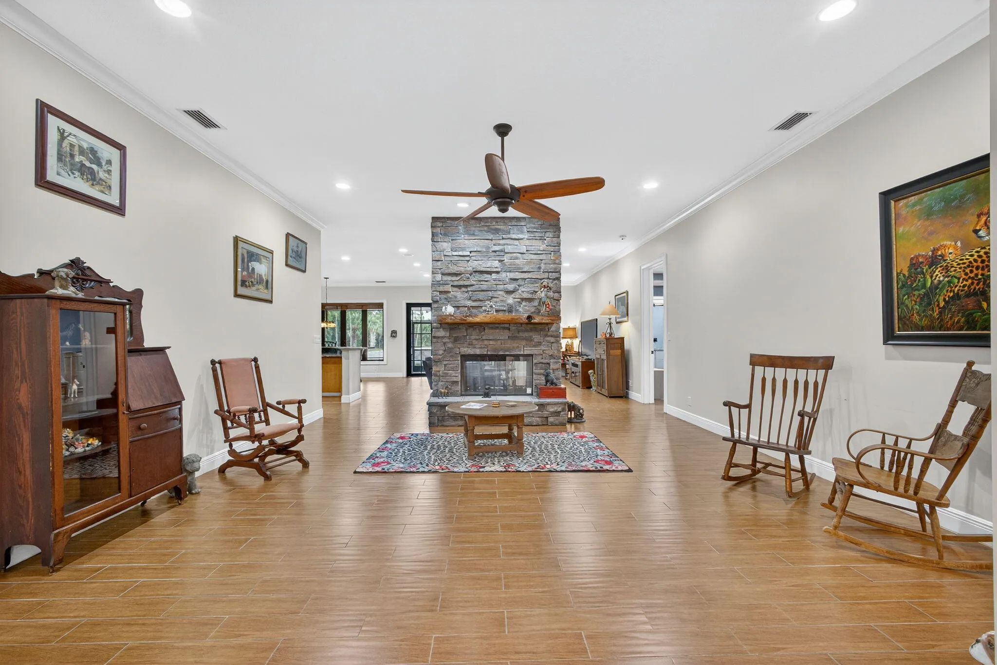 LIVING ROOM WITH A PASS THRU FIREPLACE TO THE FAMILY ROOM