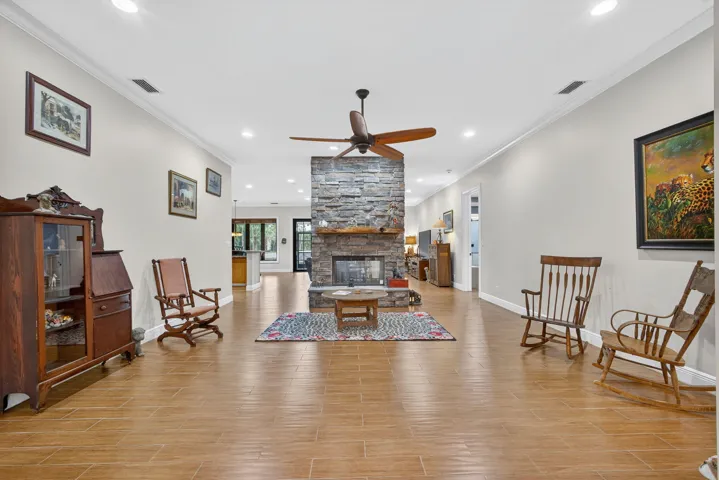 LIVING ROOM WITH A PASS THRU FIREPLACE TO THE FAMILY ROOM