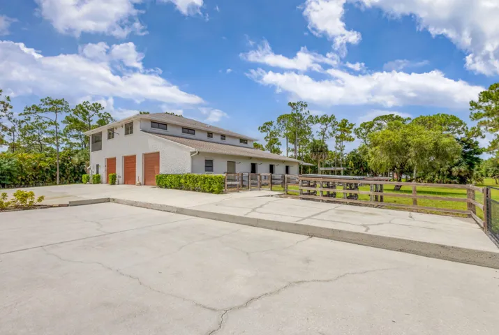 BACK BUILDING INCLUDESGUEST HOUSE, 1500 SF GARAGE, HORSE STALLS, DOG KENNELS, STORAGE...
