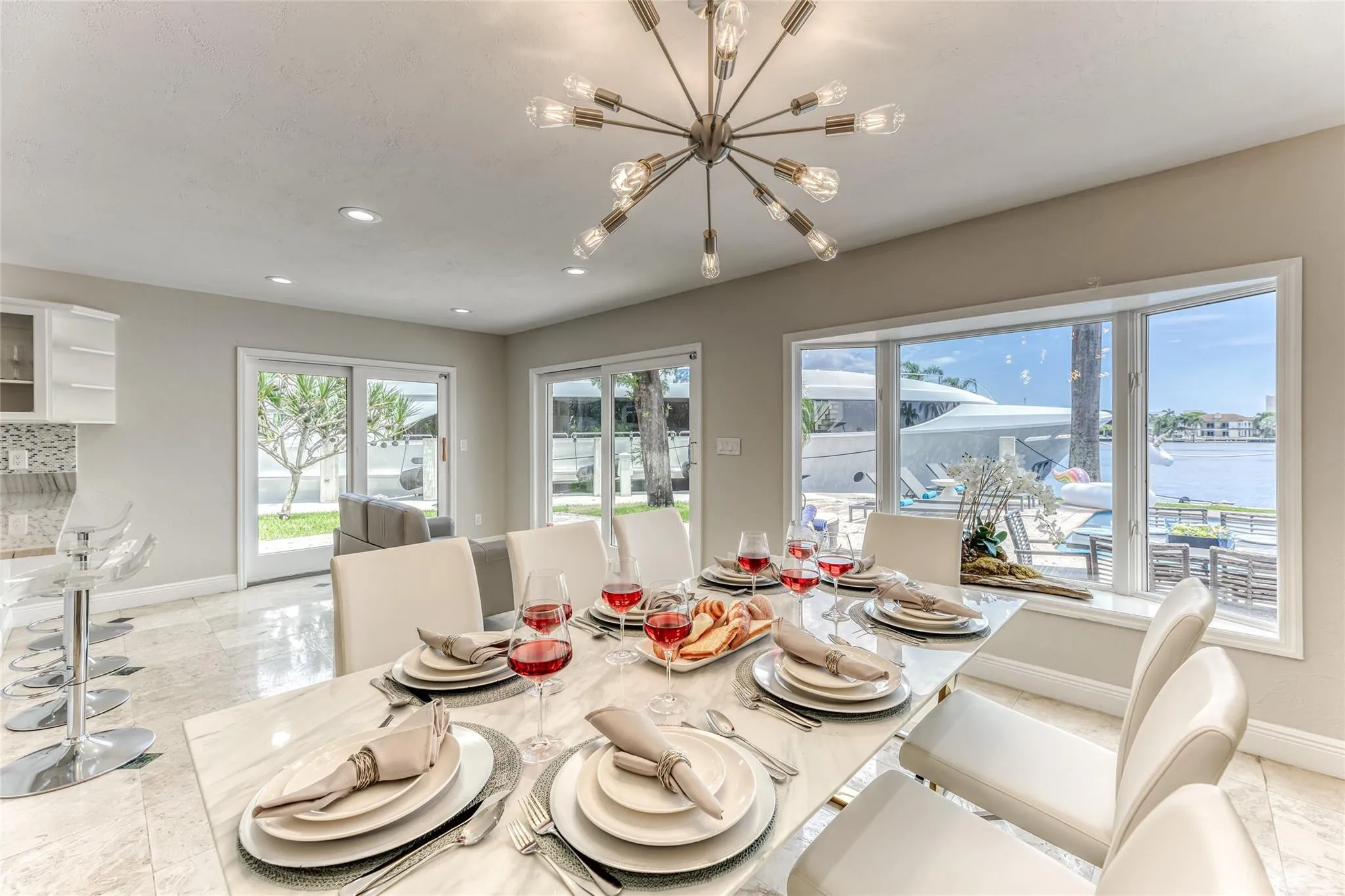 Dining Room Seating for 8 of Kitchen overlooking pool & waterway.