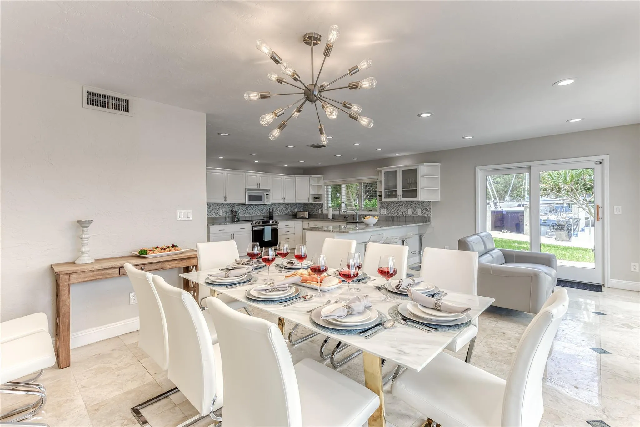 Dining Room Seating for 8 of Kitchen overlooking pool & waterway.