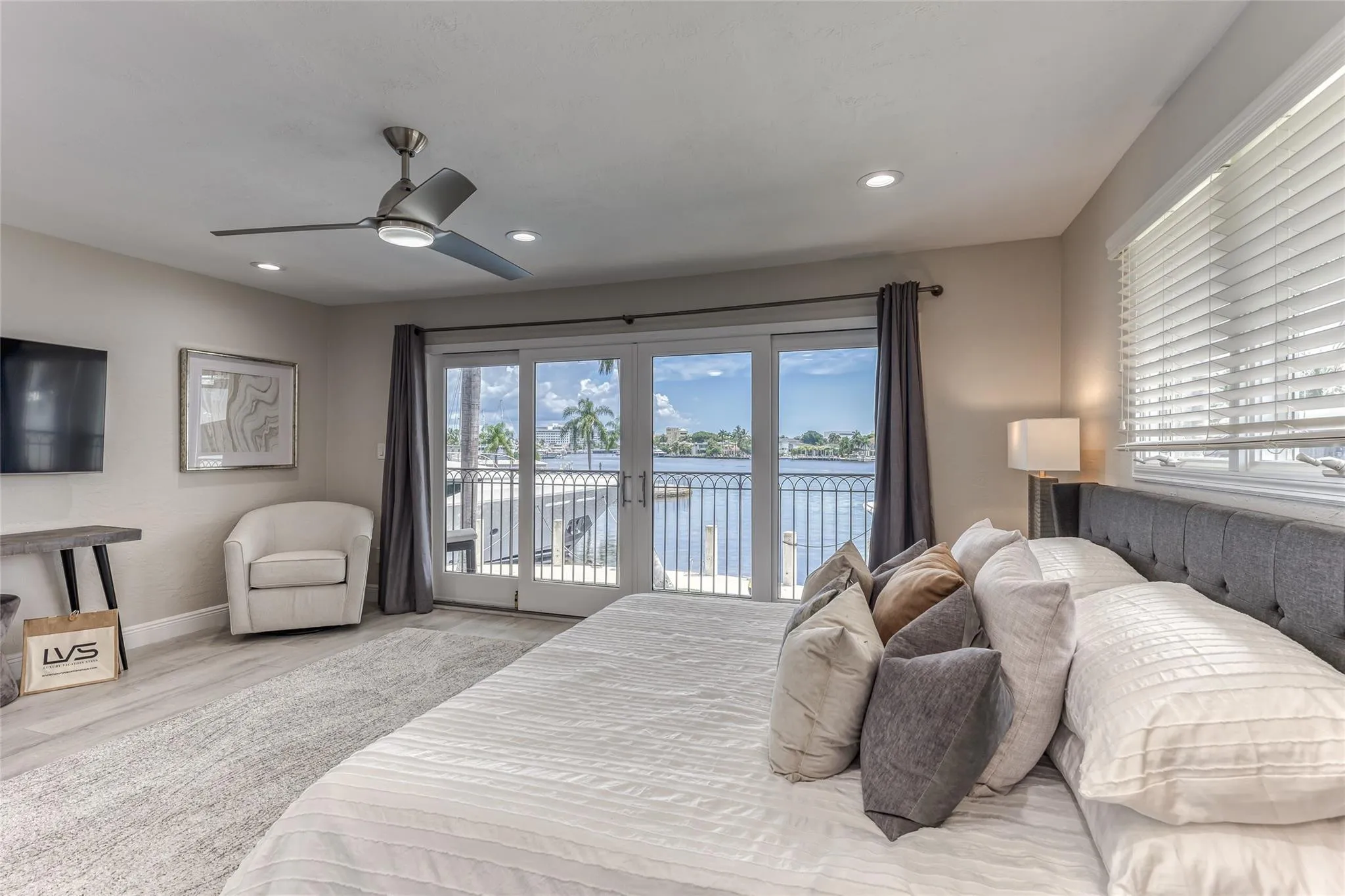 BEDROOM #2 (Upstairs) KING Size with balcony overlooking waterway with en suite bathroom, shower, smart TV