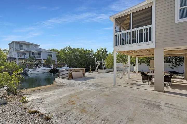 Ample covered terrace on the 1st floor and screened covered terrace on the main floor.
