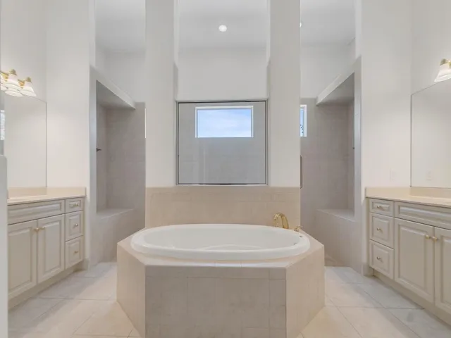 MAIN BATH WITH DOUBLE VANITIES AND LARGE SHOWER