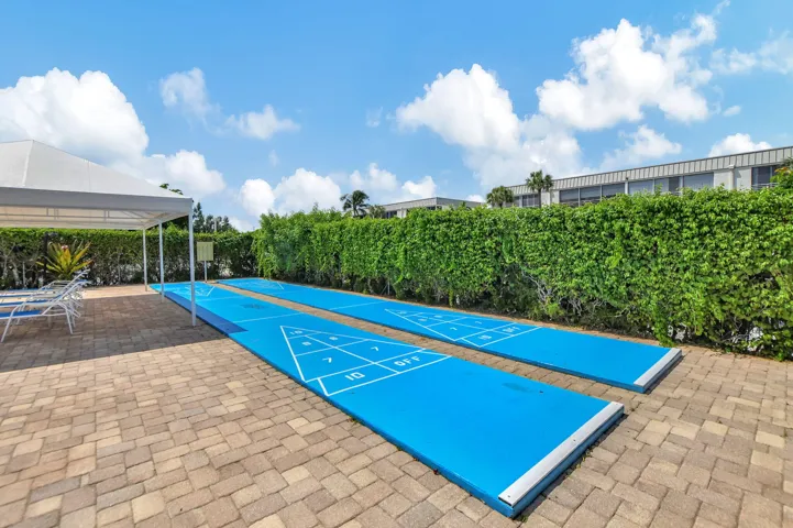 Get your SHUFFLE BOARD game ON poolside
