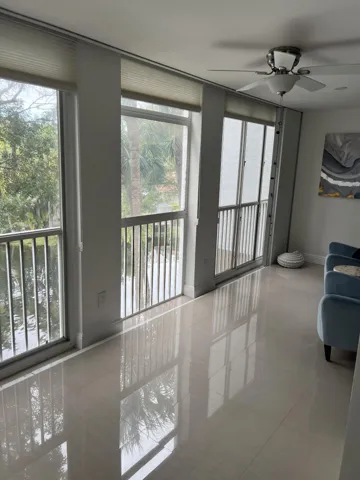 Living room smashing view of pond with lighted fountains, golf club and course