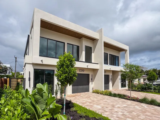(as of April 8, 2026) Front elevation facing East. Beautifully landscaped. Modern with warm tones and dimension. Featuring full-height windows throughout.