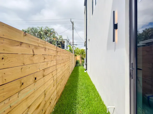 (as of April 8, 2026) side pathway to backyard and cabana bath entry.