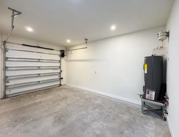 (as of April 8, 2026) Over-sized one-car garage. Side-mounted garage motor. Equipped with 220V electric vehicle plug.