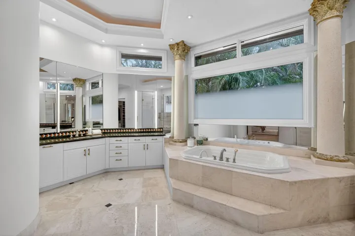 Primary Bathroom Oversized Jetted Tub with Dual Sinks plus Vanity & Custom Opaque Windows