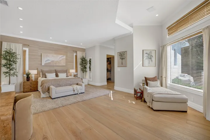 Primary Suite Retreat with Designer Wall Covering, New Oak Hardwood Flooring & Pool View