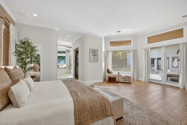 Primary Bedroom Suite with 12 Foot Ceilings, Open to Closets & Spacious Bathroom