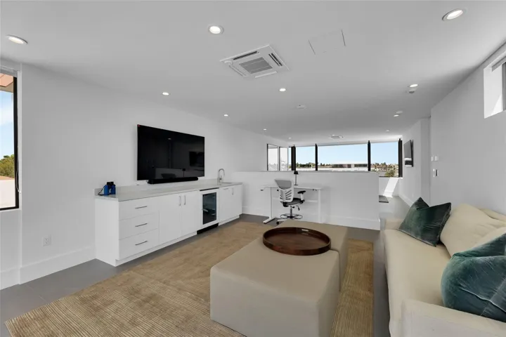 3rd Floor Den w/ Kitchenette & expansive balcony.