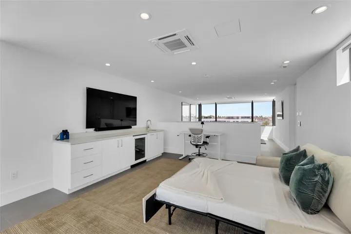 3rd Floor Den w/ Kitchenette & expansive balcony.