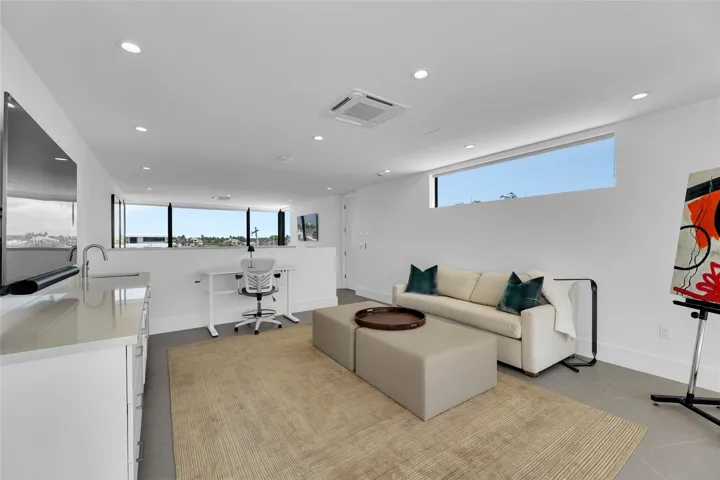 3rd Floor Den w/ Kitchenette & expansive balcony.