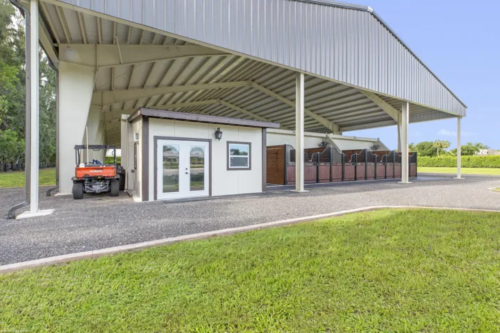 North end of covered arena with stall & tack room.