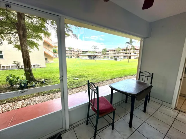 View of the pool area from the screened patio