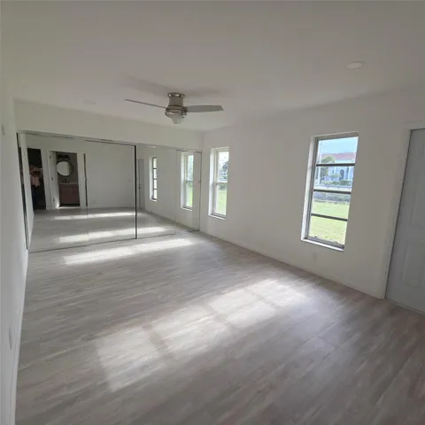 Master Bedroom has walk out door to backyard on the Canal