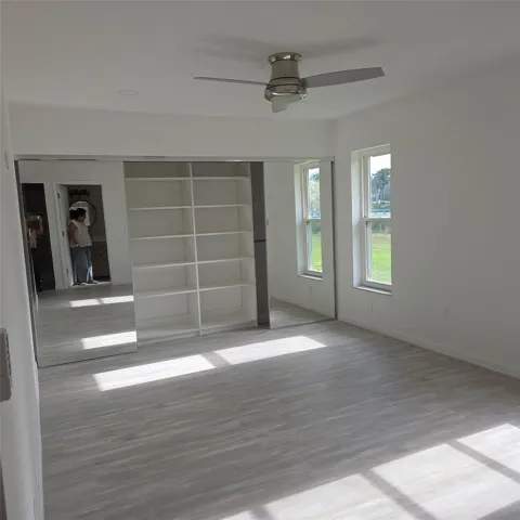 Very large, built out closet, 2 windows, new floors and fan