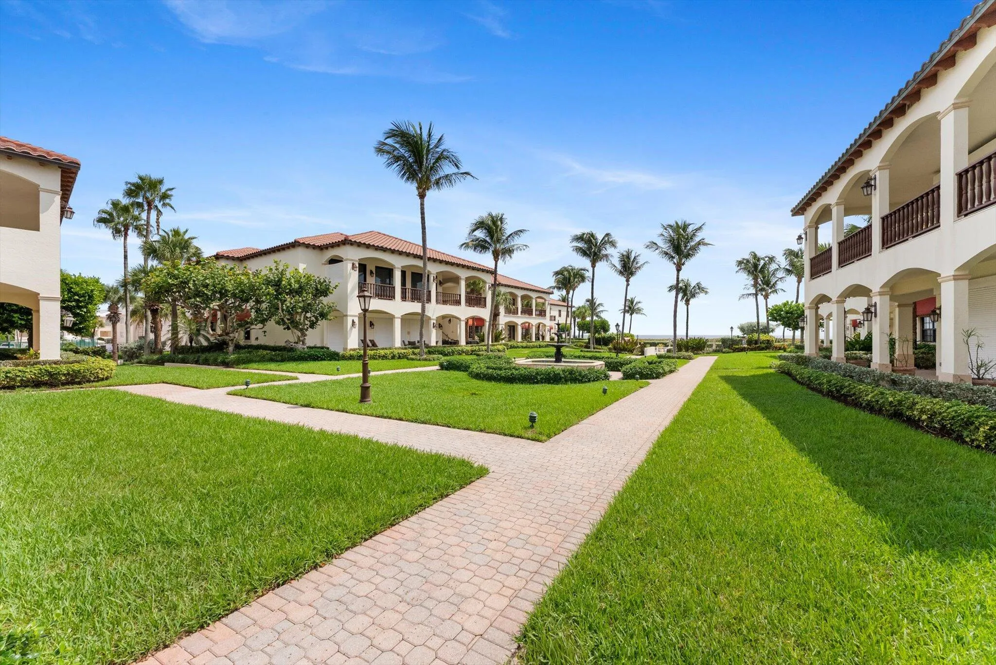 Mediterranean Courtyard leading to pool, spa, bar, and private deeded beach access...