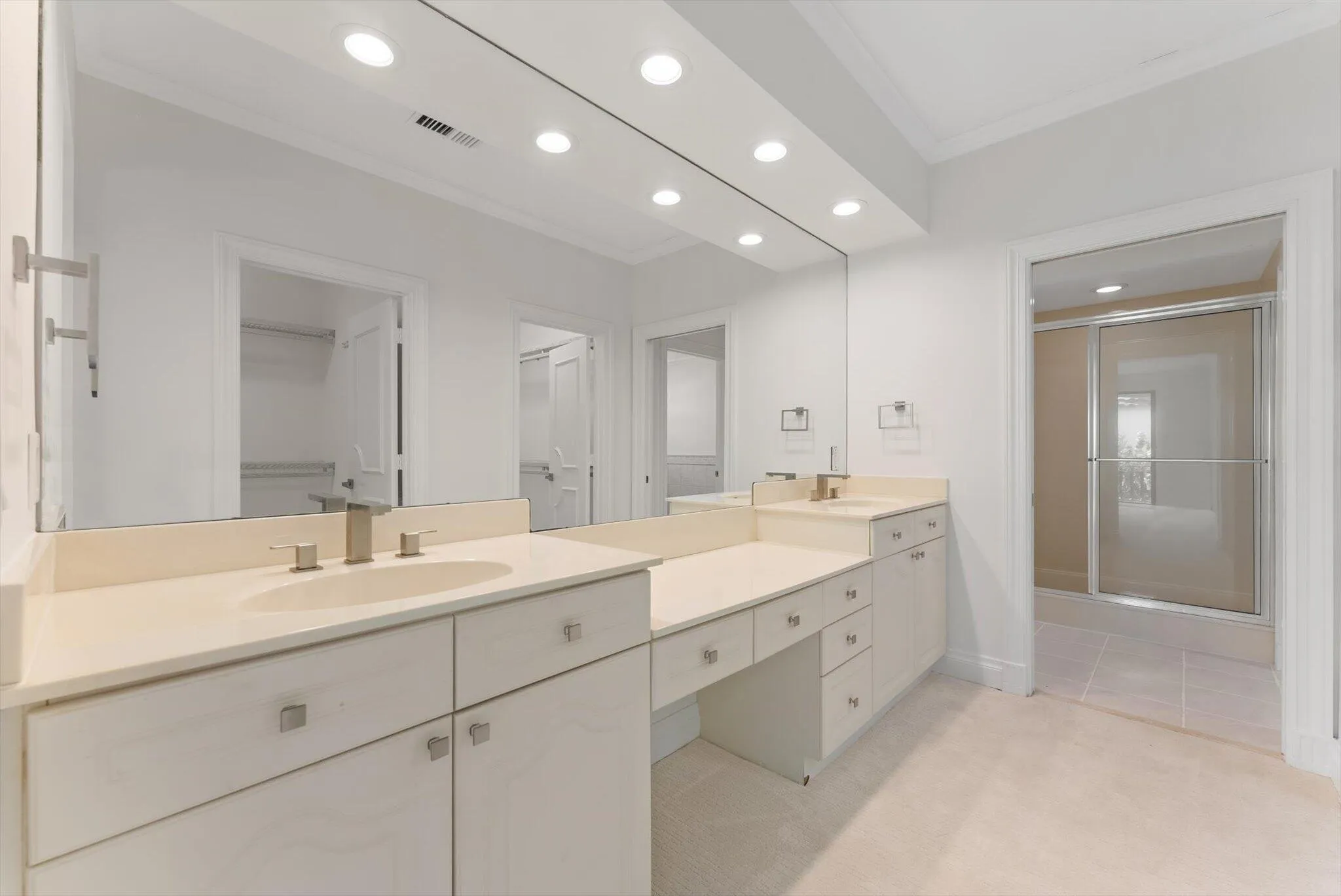 Primary Bathroom with Double Vanities and Makeup Area