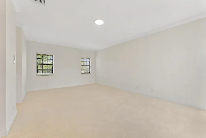 Second Bedroom with En-Suite Bathroom, Terrace access, and Dual Walk-in Closets.