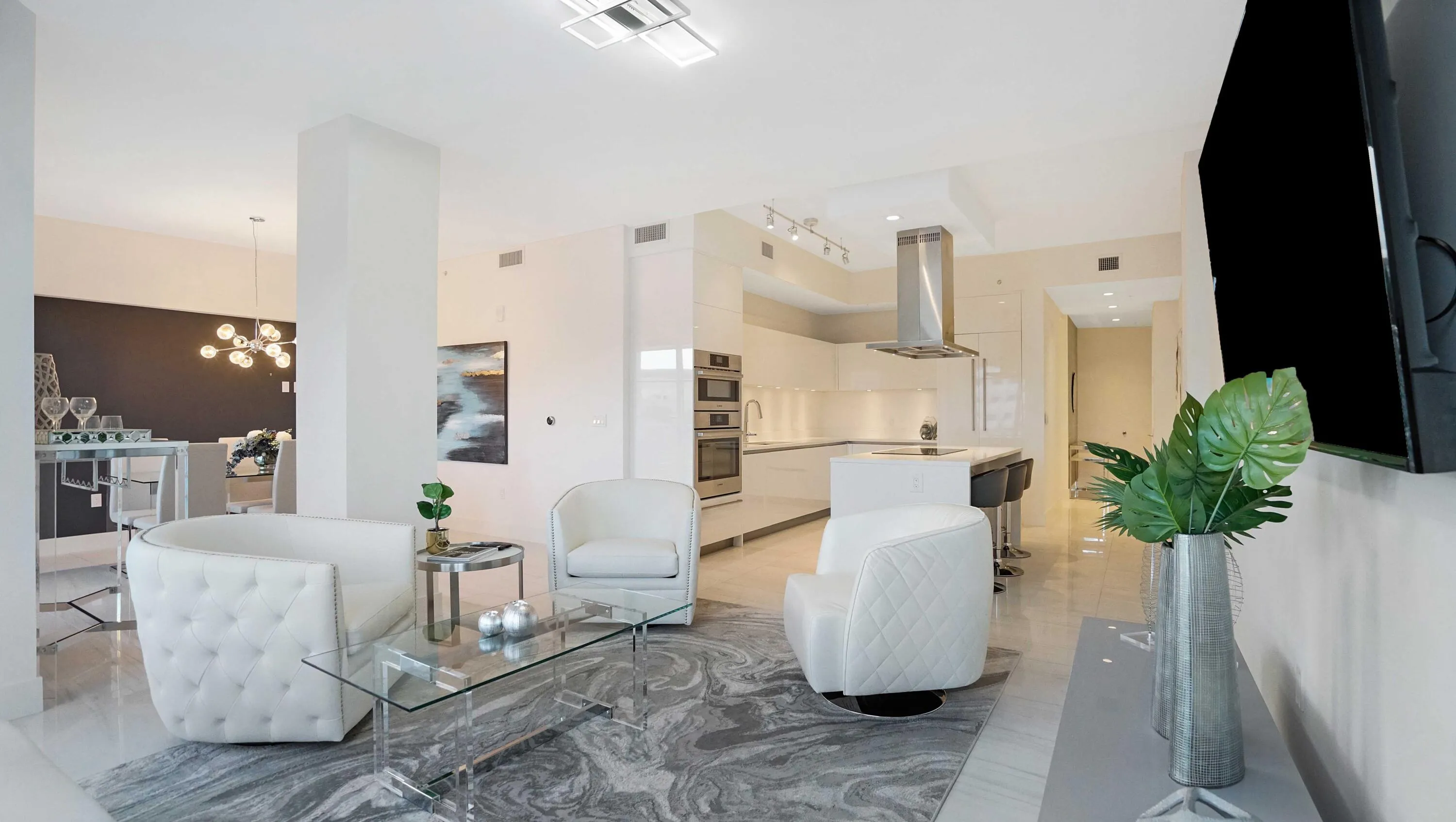 Light-filled living space with an open layout overlooking the resort-style courtyard, offering the walkable lifestyle that defines Tower 155 and Downtown Boca Raton.