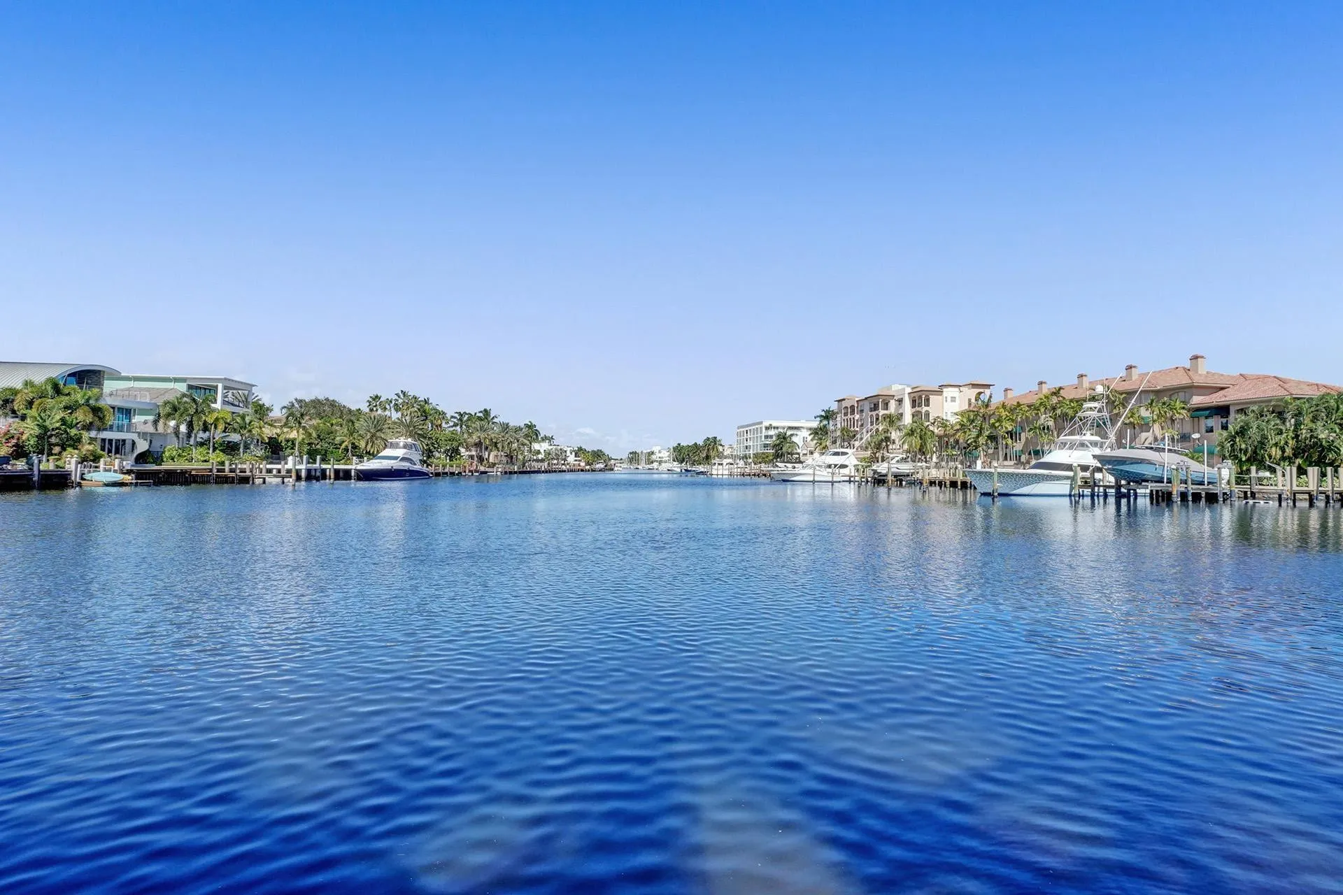 FROM THE POOL-SIDE, ENJOY THE MULTI-MILLION- DOLLAR MANSIONS SURROUNDING YOU.