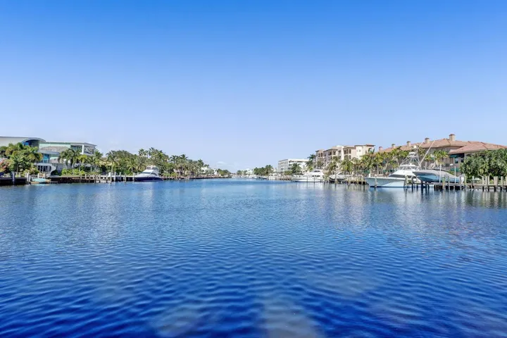 FROM THE POOL-SIDE, ENJOY THE MULTI-MILLION- DOLLAR MANSIONS SURROUNDING YOU.