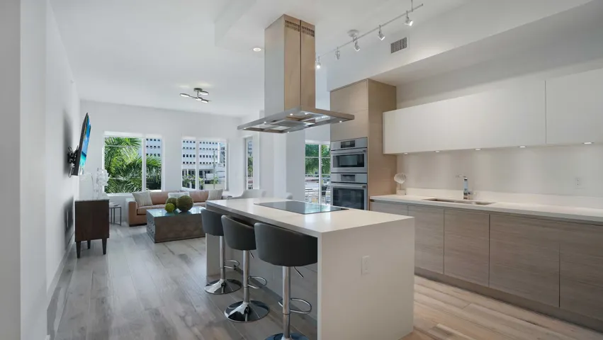 Contemporary living with Italian cabinetry, premium appliances, and an open design connecting the kitchen and living areas in one of Downtown Boca Raton's most desirable addresses.