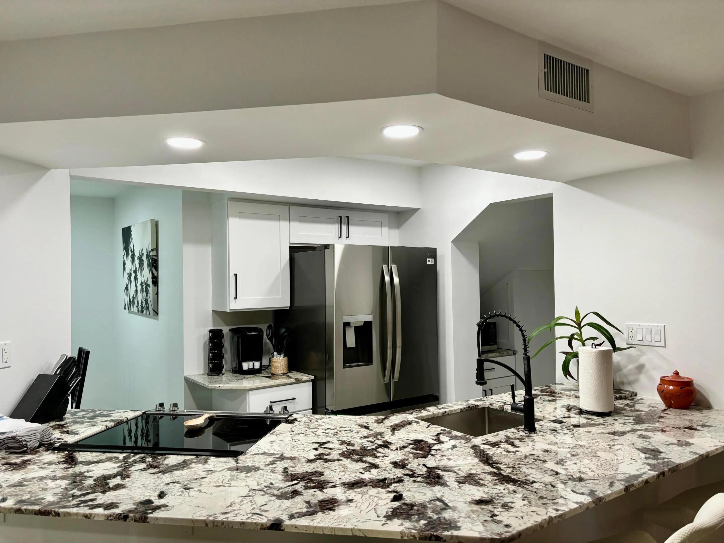 Flat stove and SS sink, granite countertop