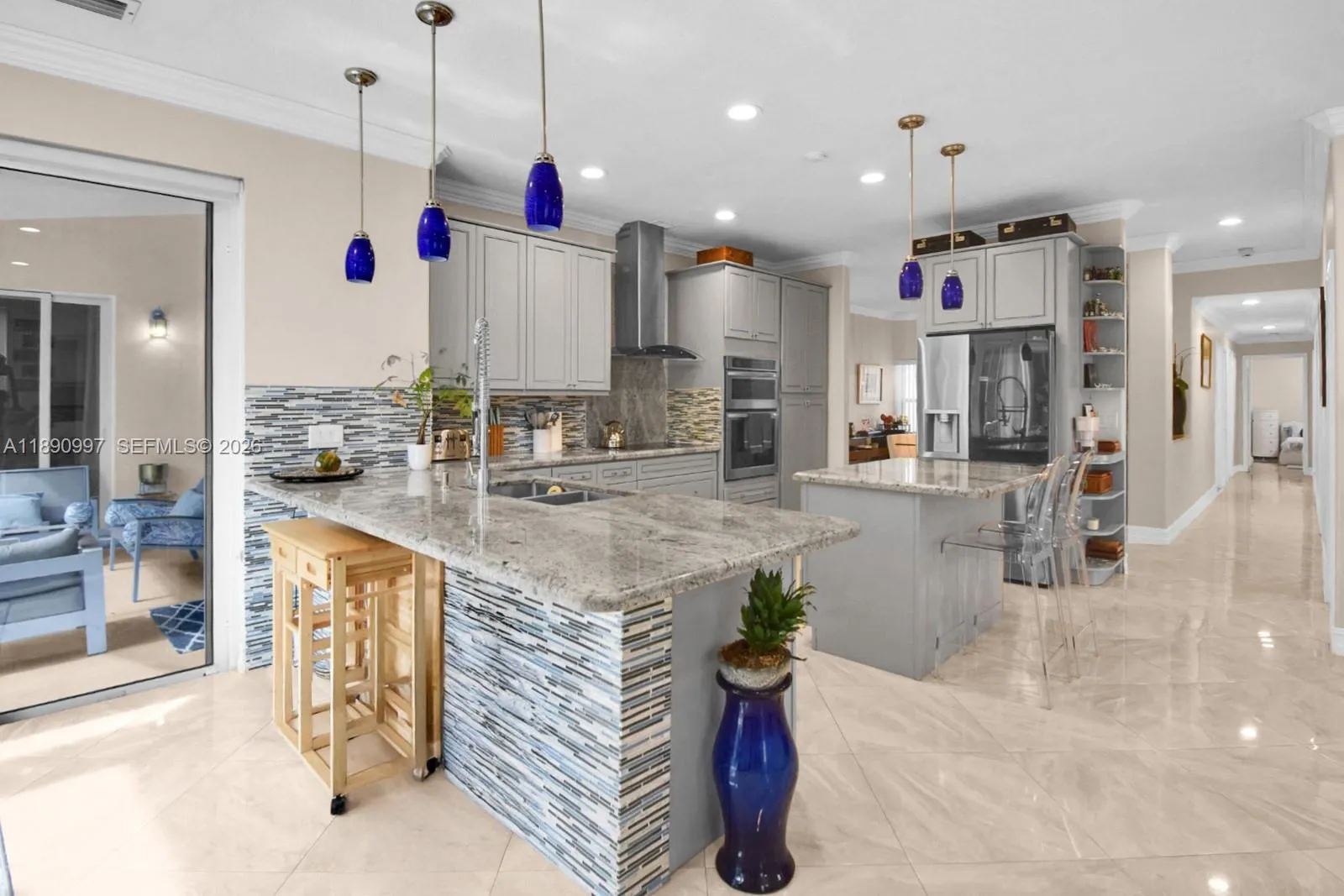Full impact doors and quartz countertops leading to the secondary bedroom wing