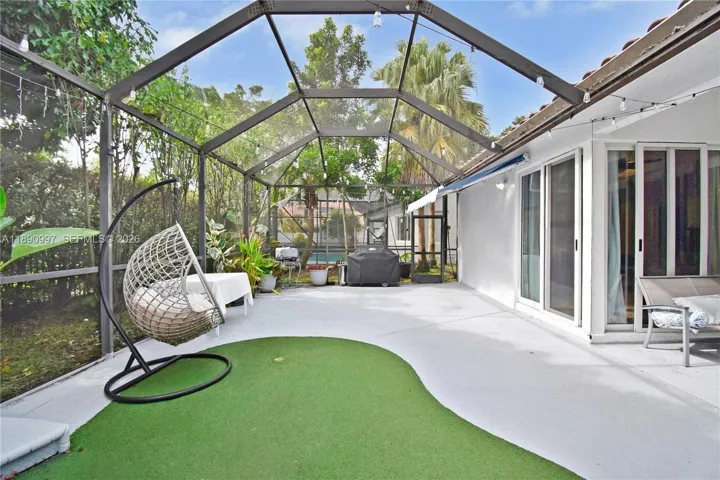 Screened patio offering flexible indoor-outdoor living with potential to expand