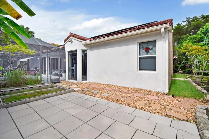 Screened patio adjacent to open patio, offering the opportunity to create one expansive outdoor living space