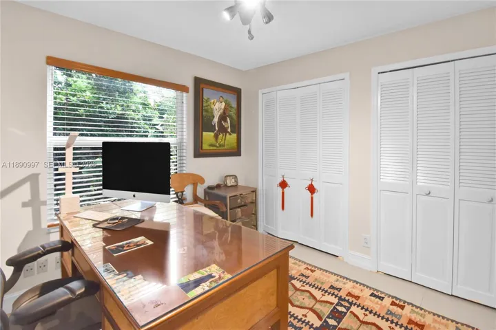 Large bedroom with french doors currently used as an office