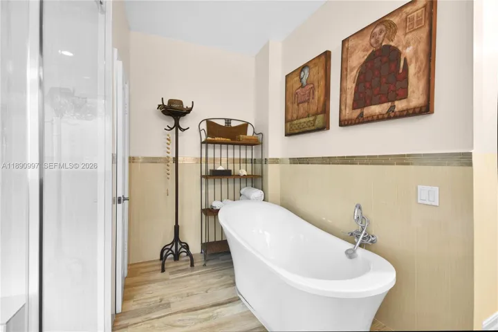 Spa-inspired primary bathroom with freestanding soaking tub