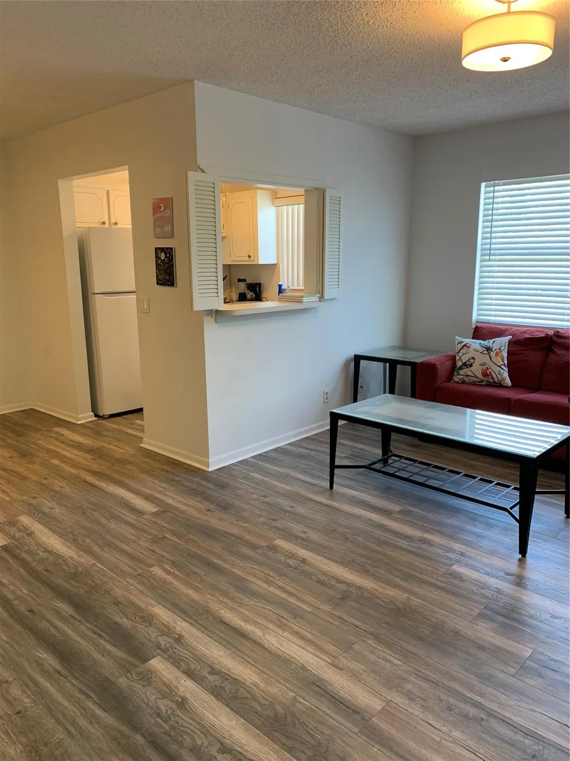 Living room area, showing kitchen area.