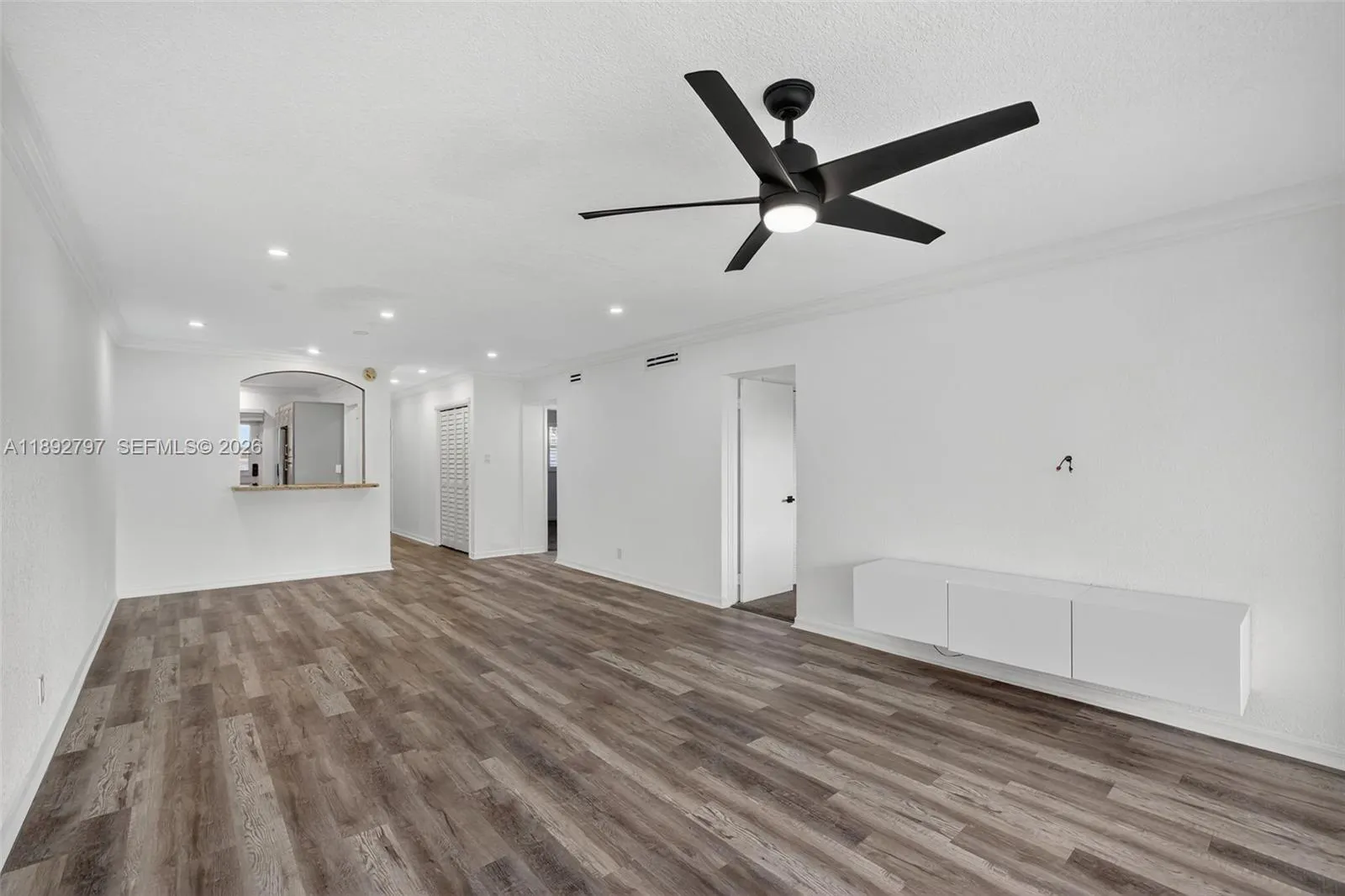 Flat Ceilings with high hat lighting. Updated flooring and paint, Impact Windows